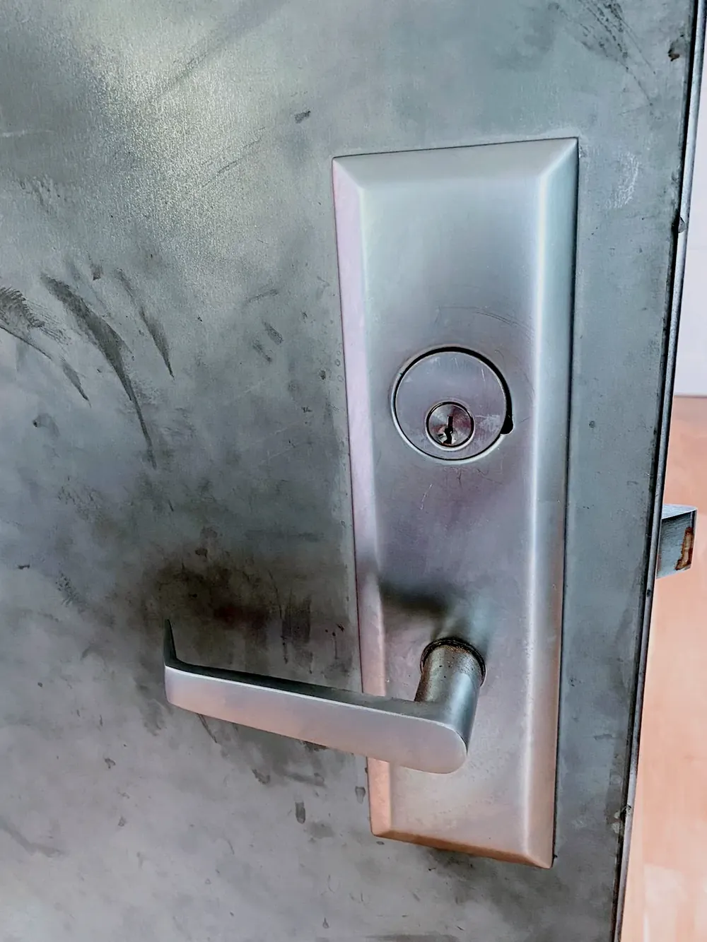 Commercial mortise lever lock on a steel door