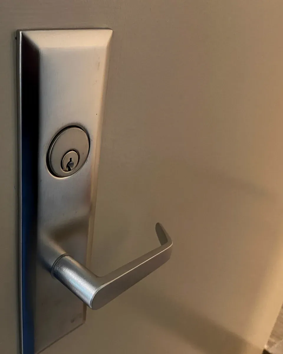 Commercial mortise lever lock on a business door